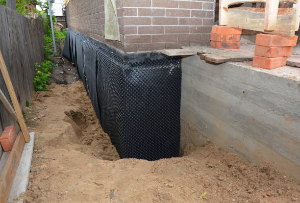 Happy homeowners after waterproofing job in Pomfret